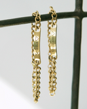 Couples Engraved Bracelet Set hanging from a bar